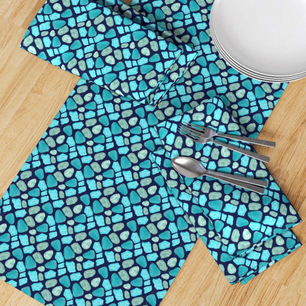 Table runner and napkins featuring marine green and sky blue diamonds with beach rocks and sea glass on navy blue